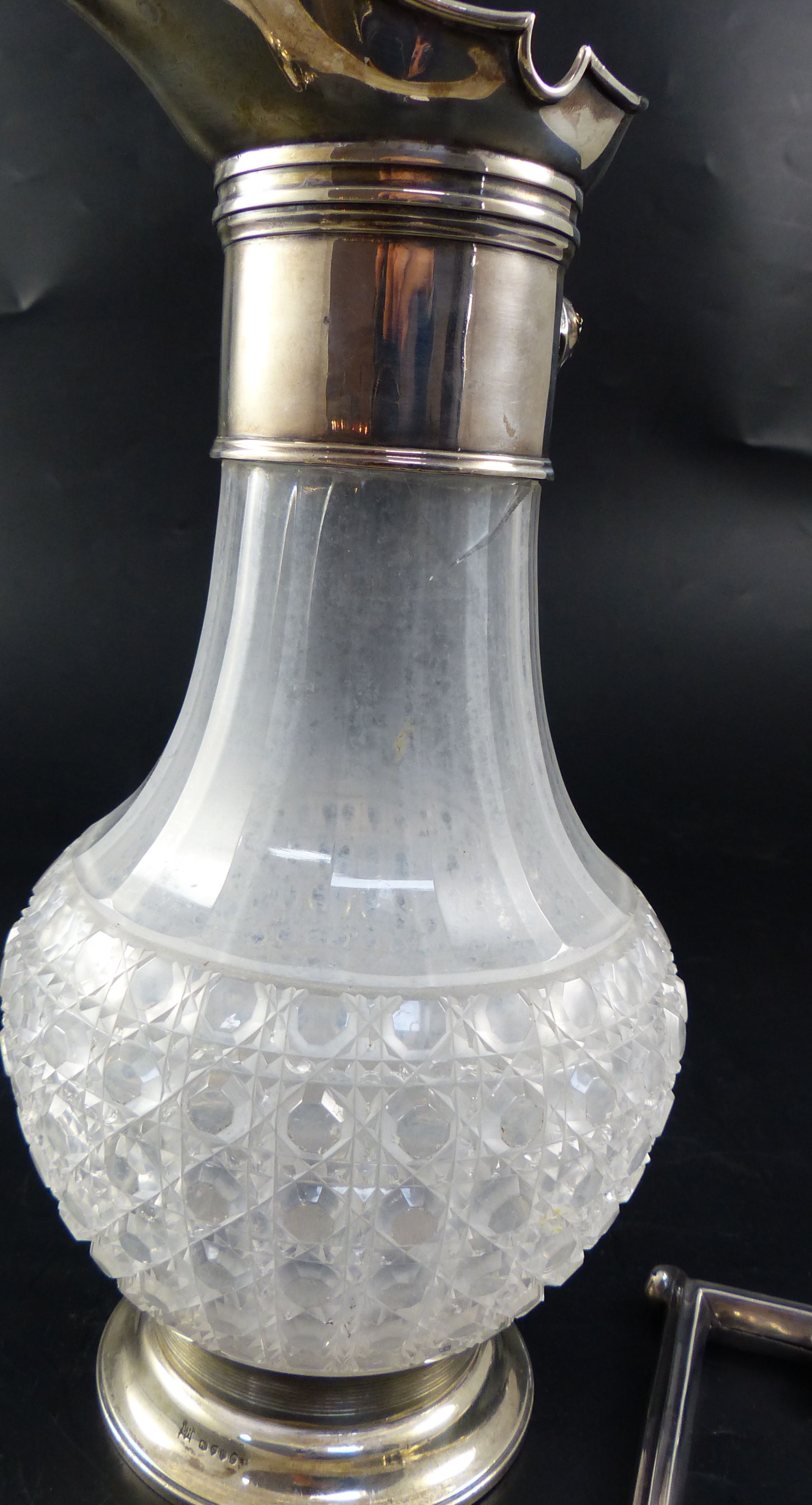 A Victorian silver mounted cut-glass claret jug, height 27.9cm (handle and lid detached/broken)